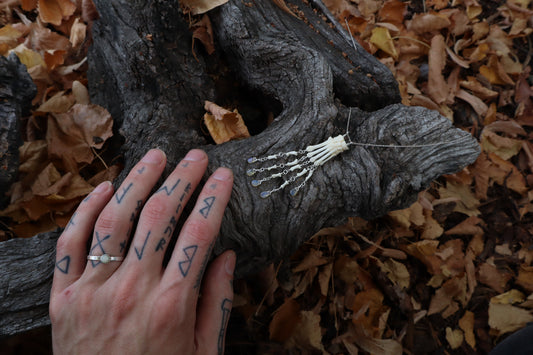 Fluid Striped Skunk Paw Articulation Necklace with Opal “Claws”