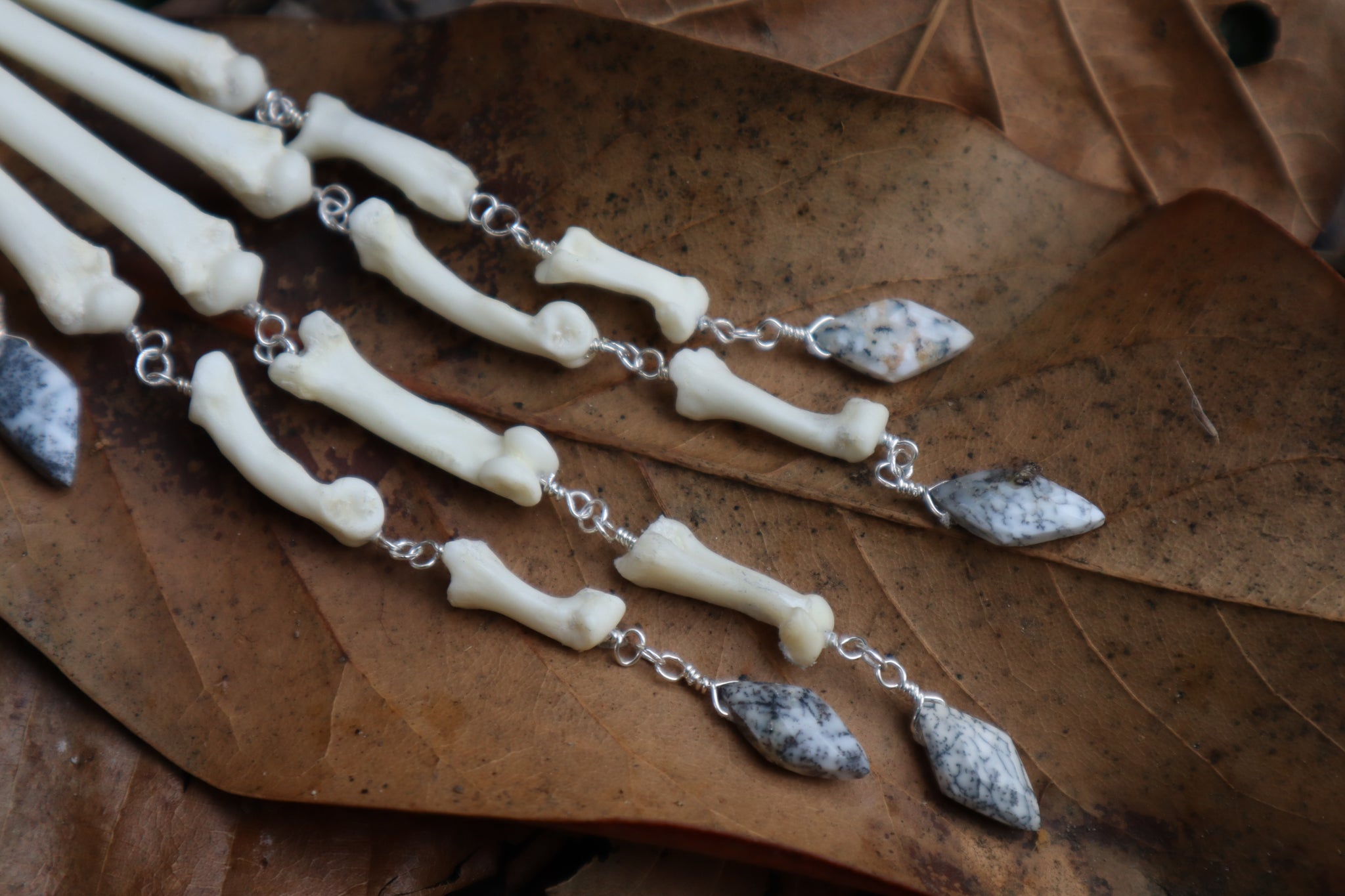 Fluid Bobcat Paw Articulation with Dendritic Opal “Claws”