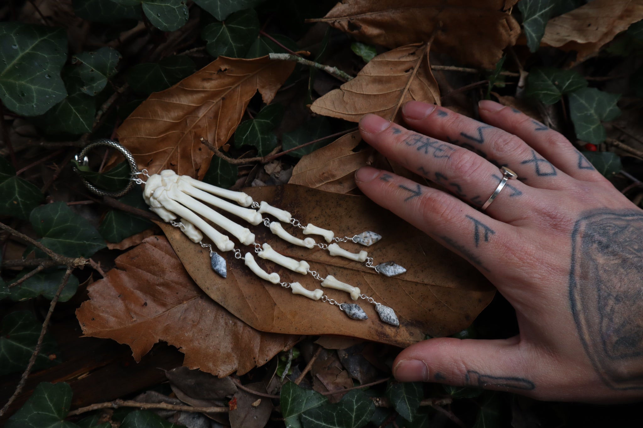 Fluid Bobcat Paw Articulation with Dendritic Opal “Claws”