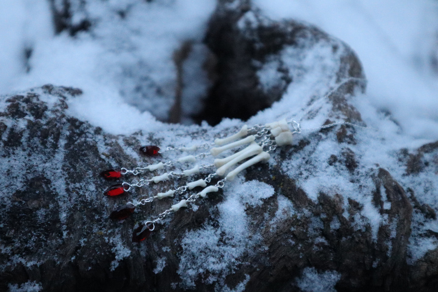 Reserved for Ann-Marie Beach - Fluid Striped Skunk Paw Articulation Necklace with Garnet “Claws”