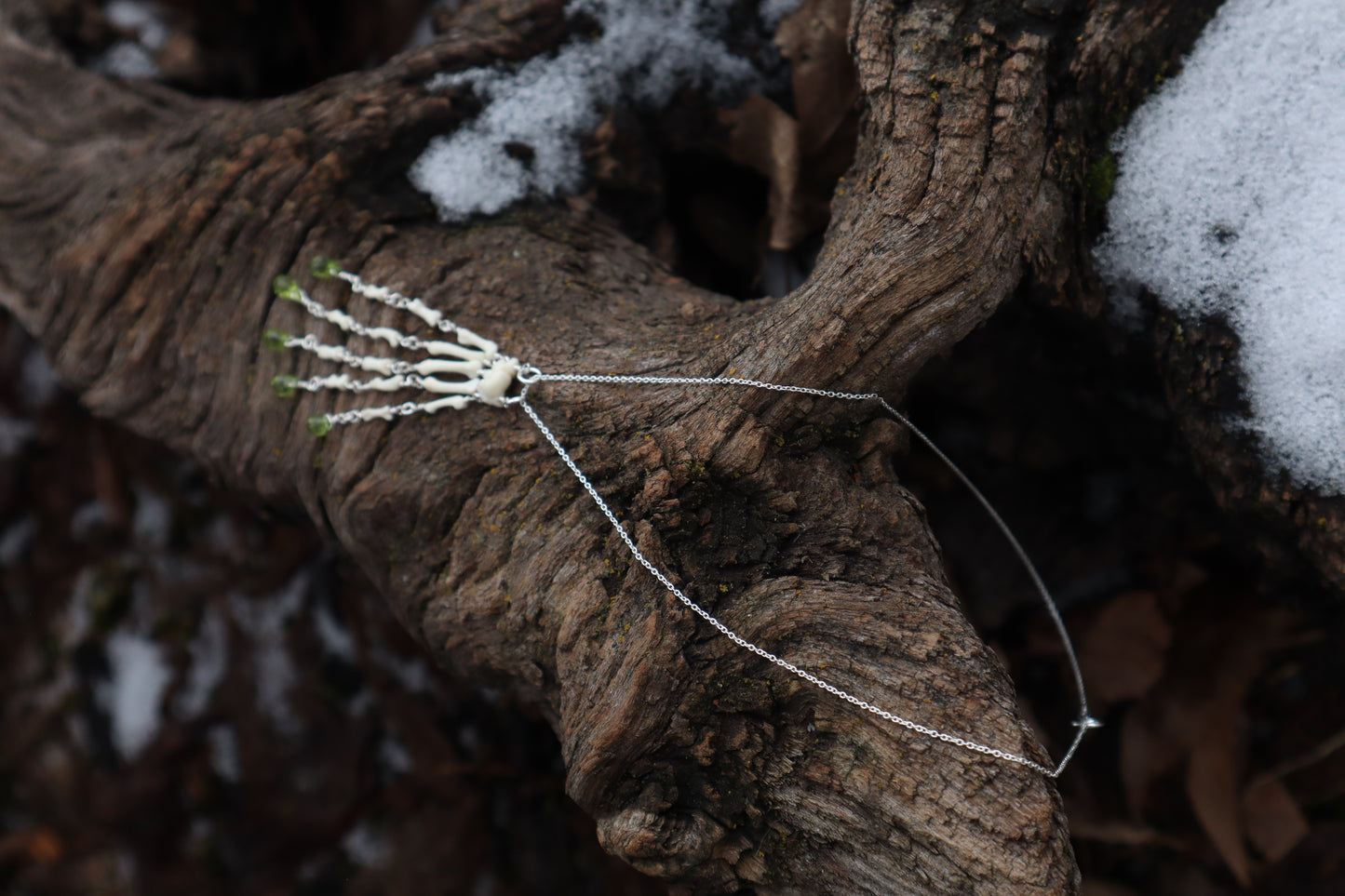 Fluid Striped Skunk Paw Articulation Necklace with Peridot “Claws”