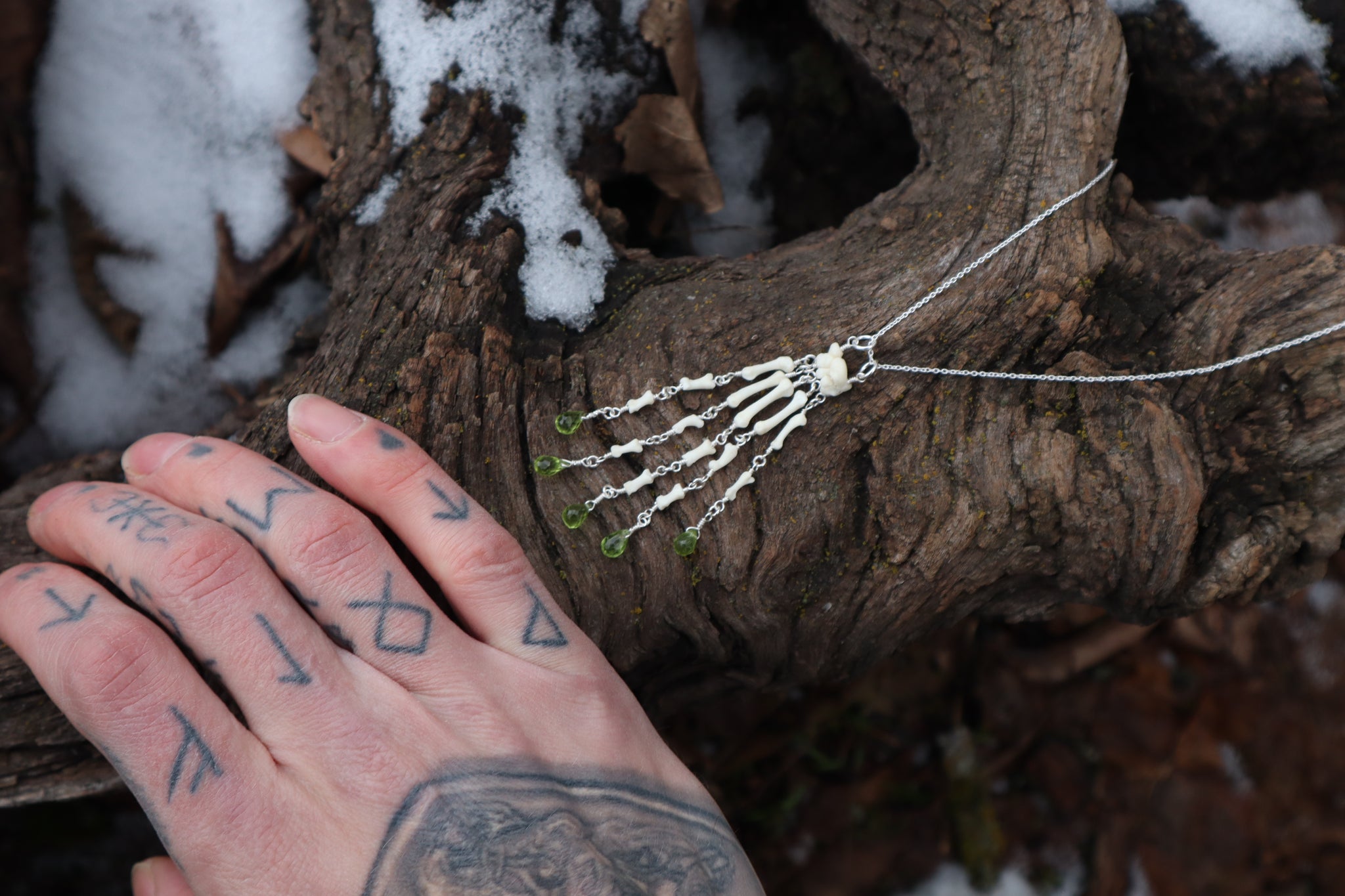 Fluid Striped Skunk Paw Articulation Necklace with Peridot “Claws”