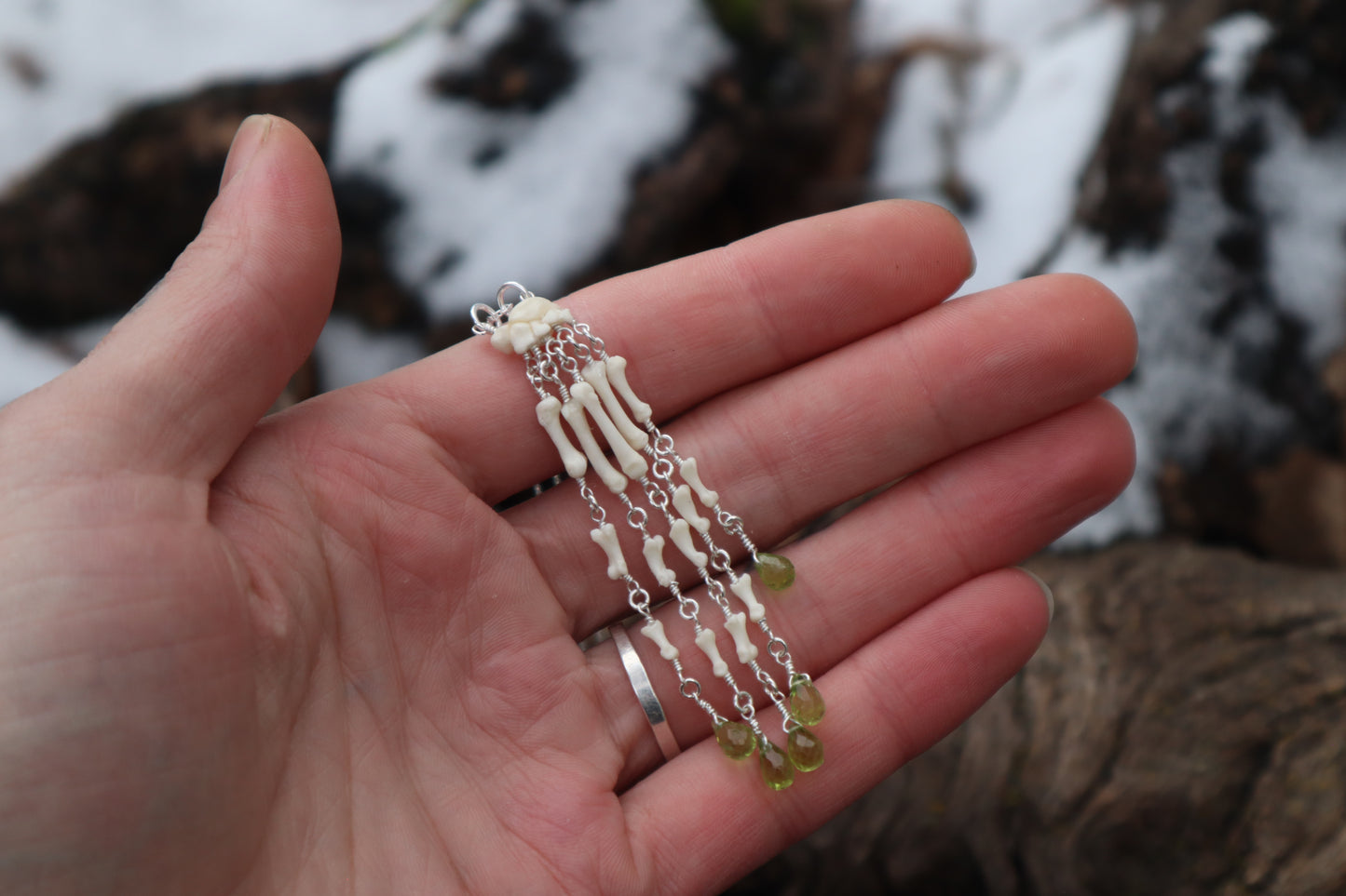 Fluid Striped Skunk Paw Articulation Necklace with Peridot “Claws”