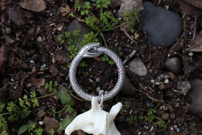Fluid Gray Wolf Tail Articulation with Ouroboros Ring