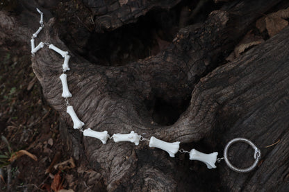 Fluid Gray Wolf Tail Articulation with Ouroboros Ring
