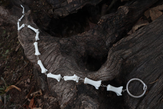 Fluid Gray Wolf Tail Articulation with Ouroboros Ring