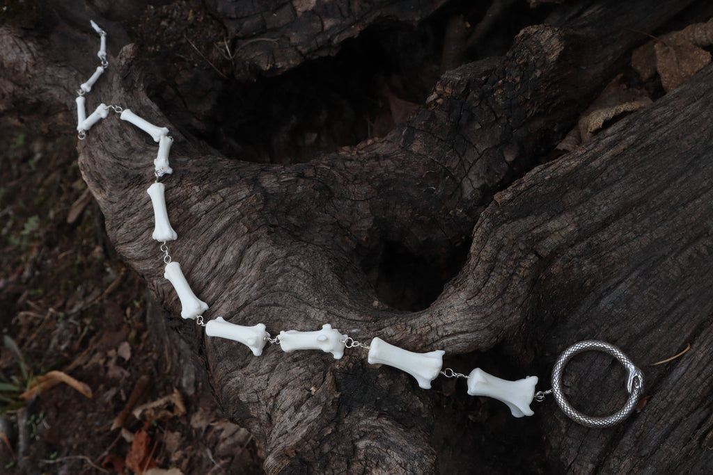 Fluid Gray Wolf Tail Articulation with Ouroboros Ring