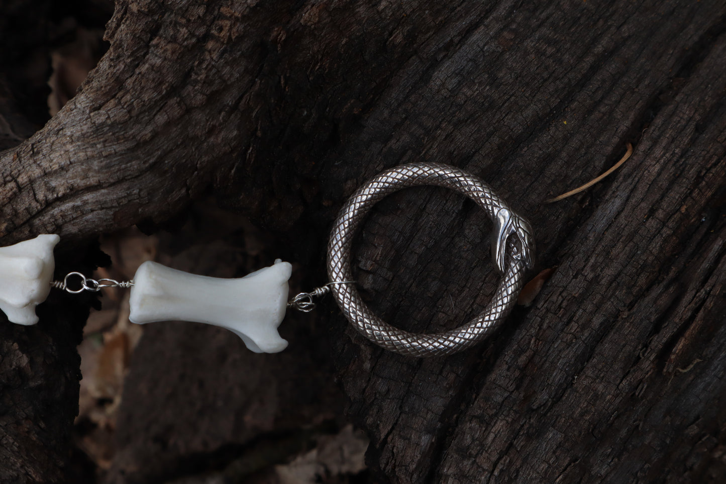 Fluid Gray Wolf Tail Articulation with Ouroboros Ring