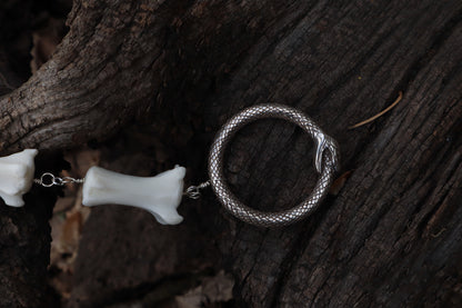 Fluid Gray Wolf Tail Articulation with Ouroboros Ring