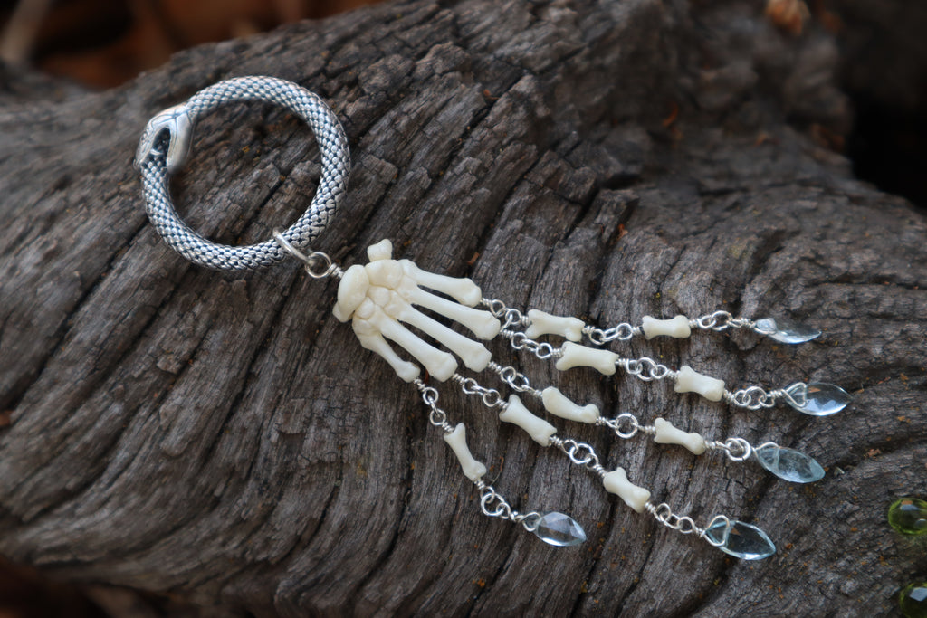 Fluid Striped Skunk Paw Articulation with Sky Blue Topaz “Claws”