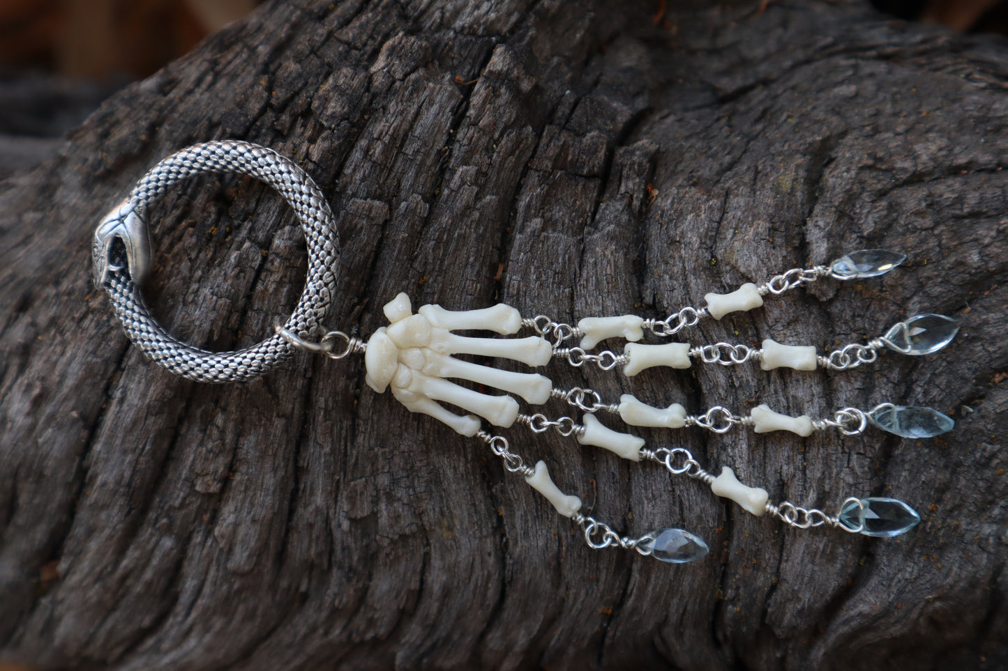 Fluid Striped Skunk Paw Articulation with Sky Blue Topaz “Claws”