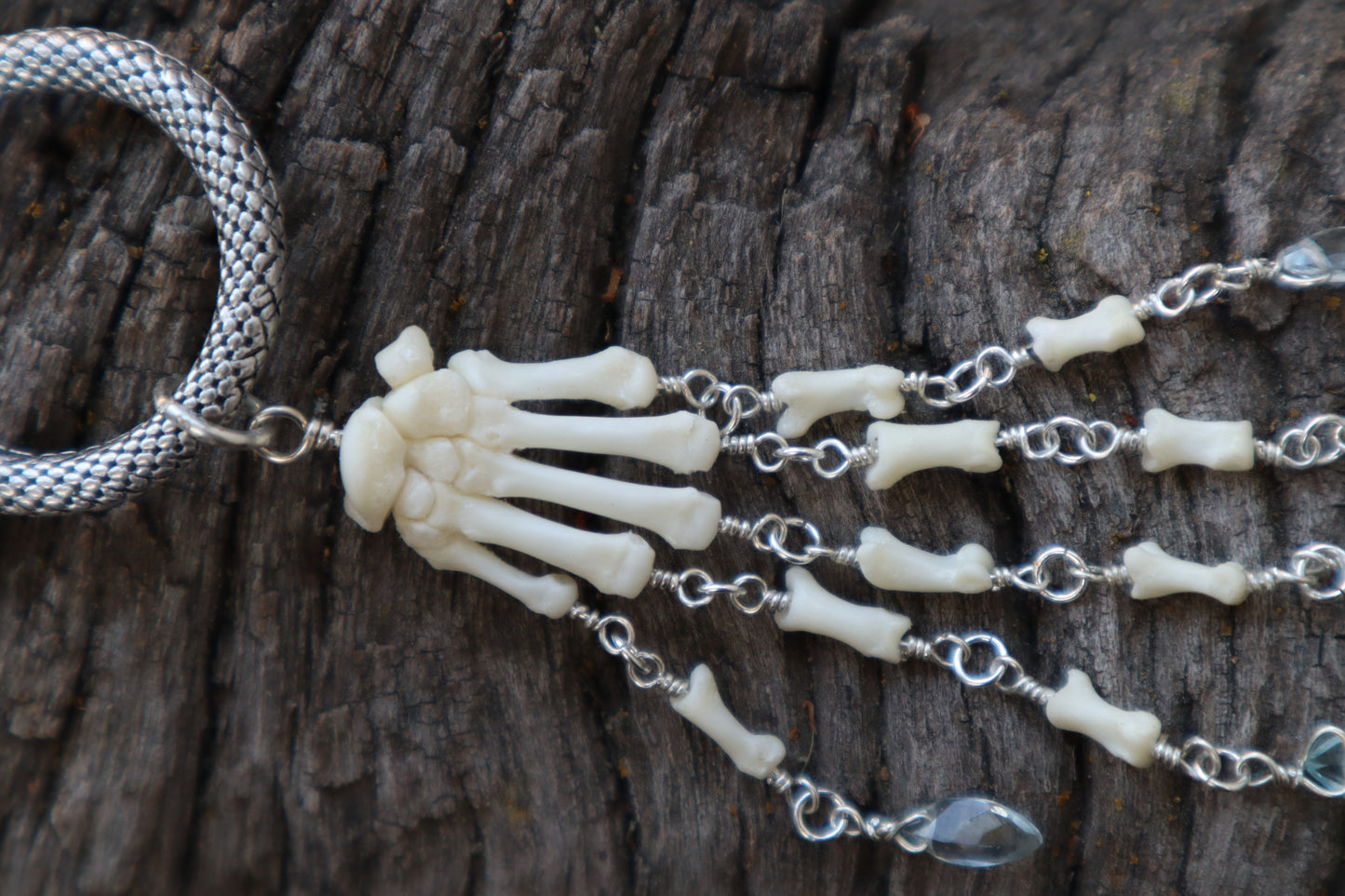 Fluid Striped Skunk Paw Articulation with Sky Blue Topaz “Claws”