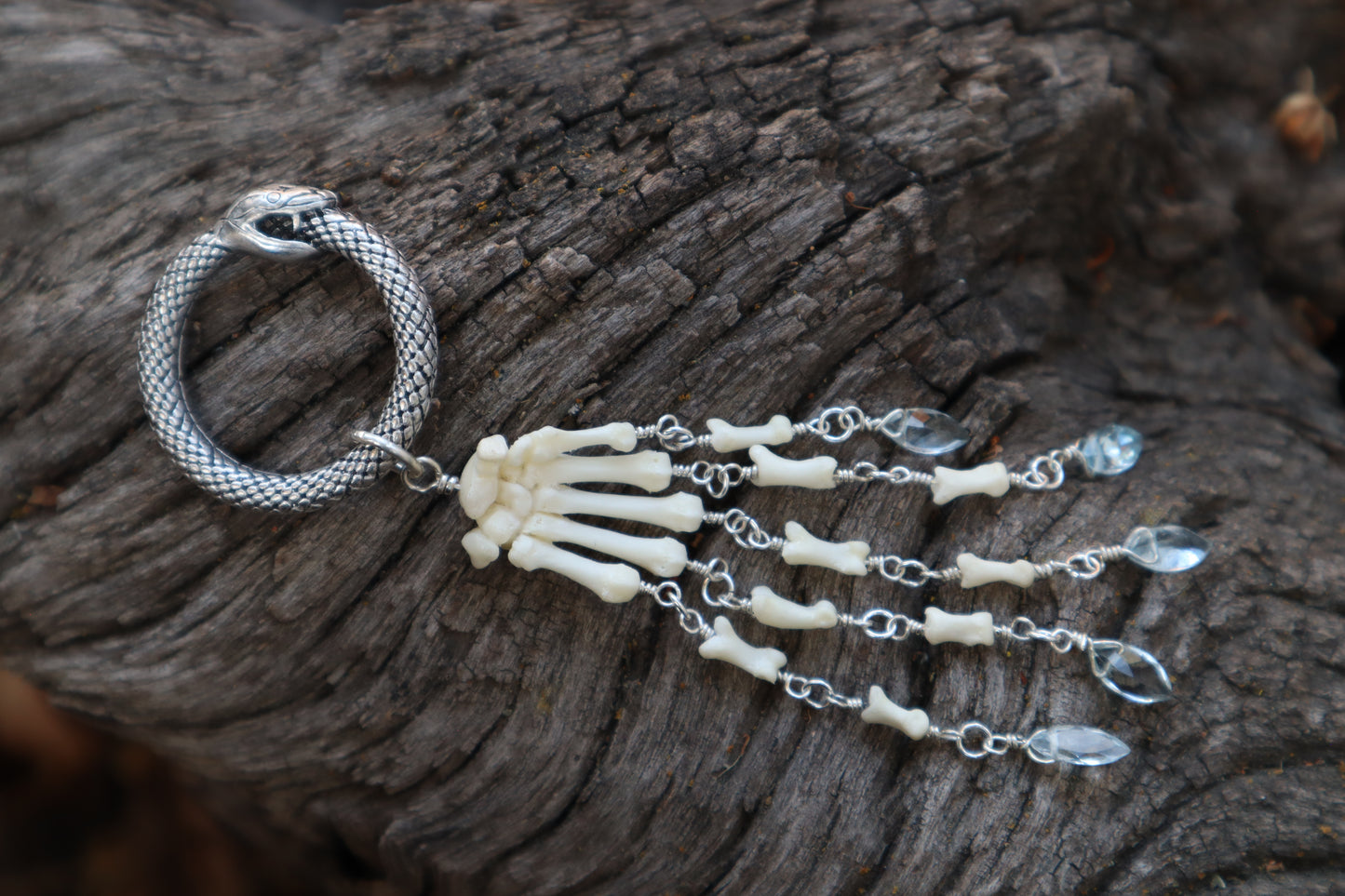 Fluid Striped Skunk Paw Articulation with Sky Blue Topaz “Claws”