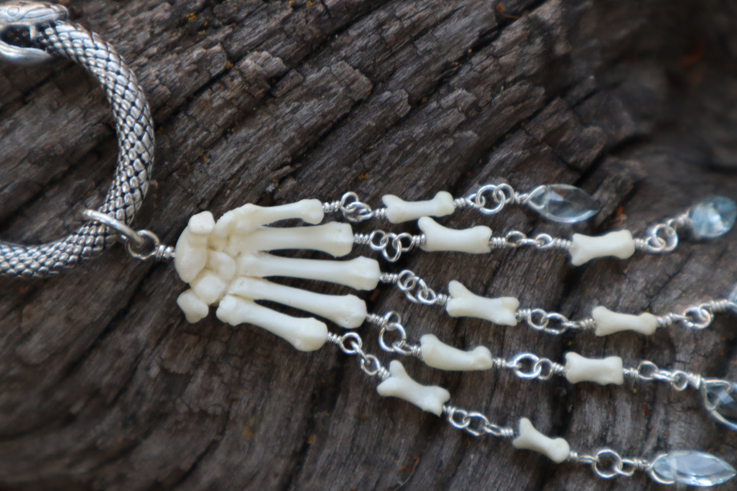 Fluid Striped Skunk Paw Articulation with Sky Blue Topaz “Claws”