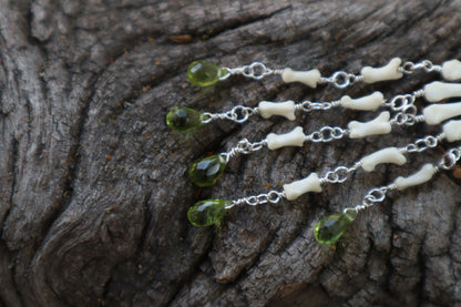 Fluid Striped Skunk Paw Articulation with Peridot “Claws”