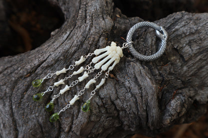 Fluid Striped Skunk Paw Articulation with Peridot “Claws”