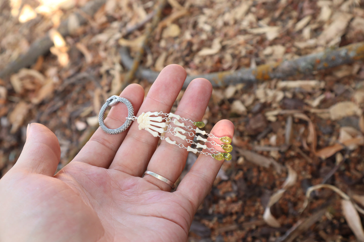 Fluid Striped Skunk Paw Articulation with Peridot “Claws”