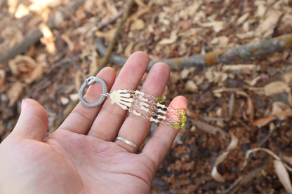 Fluid Striped Skunk Paw Articulation with Peridot “Claws”