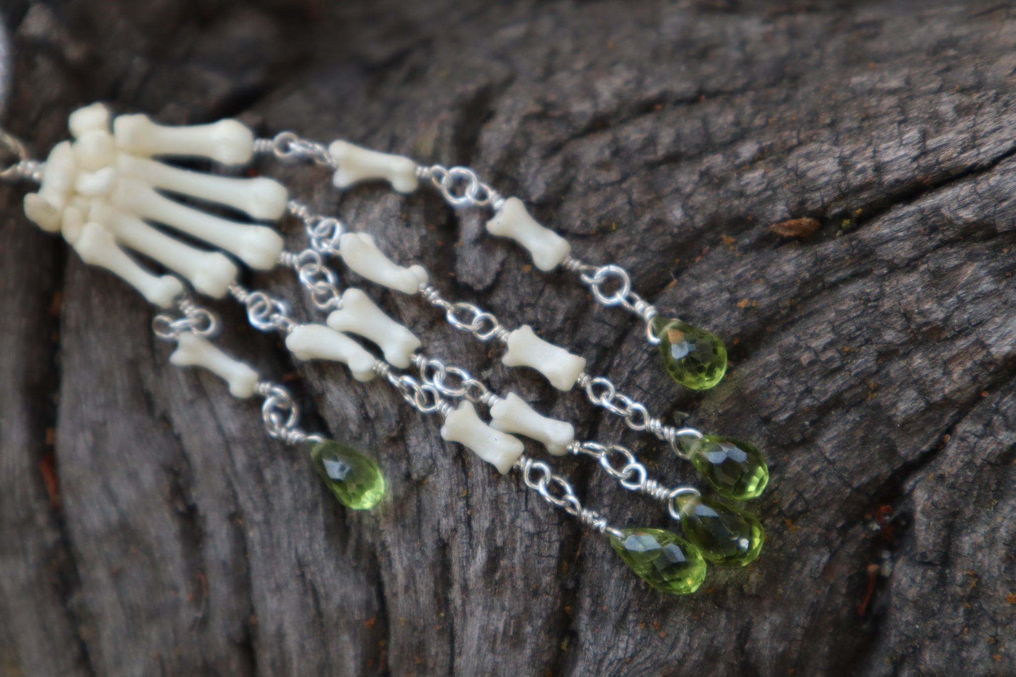 Fluid Striped Skunk Paw Articulation with Peridot “Claws”
