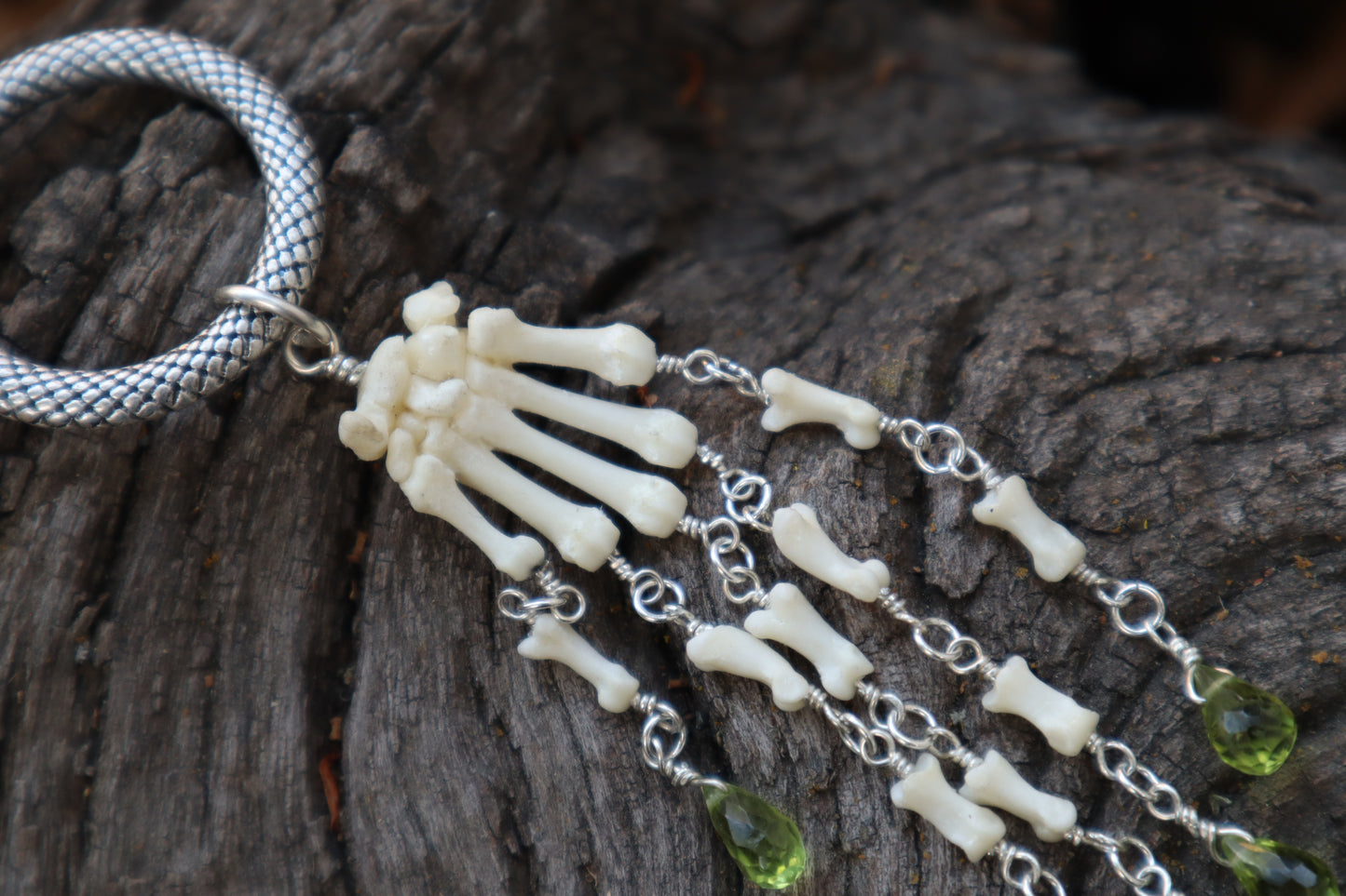 Fluid Striped Skunk Paw Articulation with Peridot “Claws”