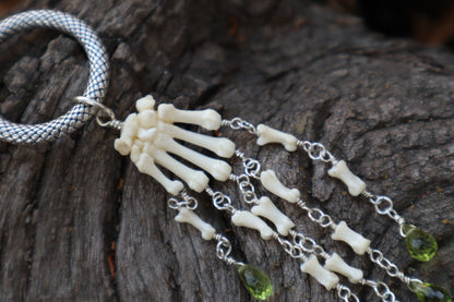 Fluid Striped Skunk Paw Articulation with Peridot “Claws”