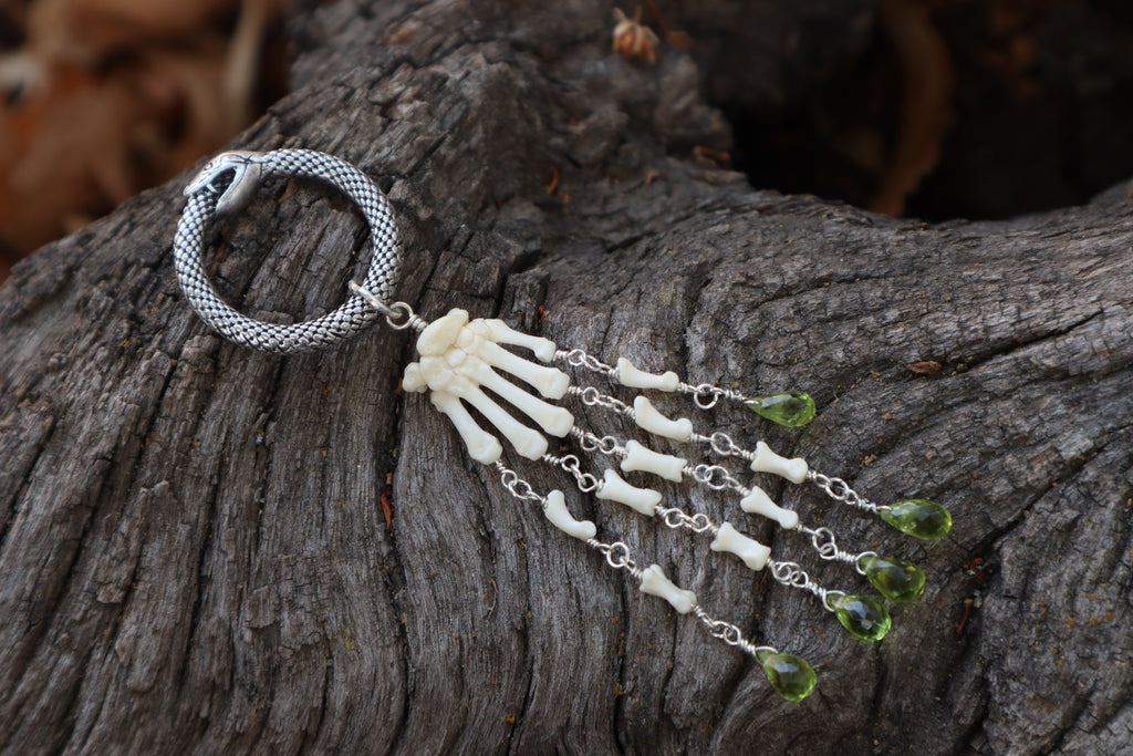 Fluid Striped Skunk Paw Articulation with Peridot “Claws”