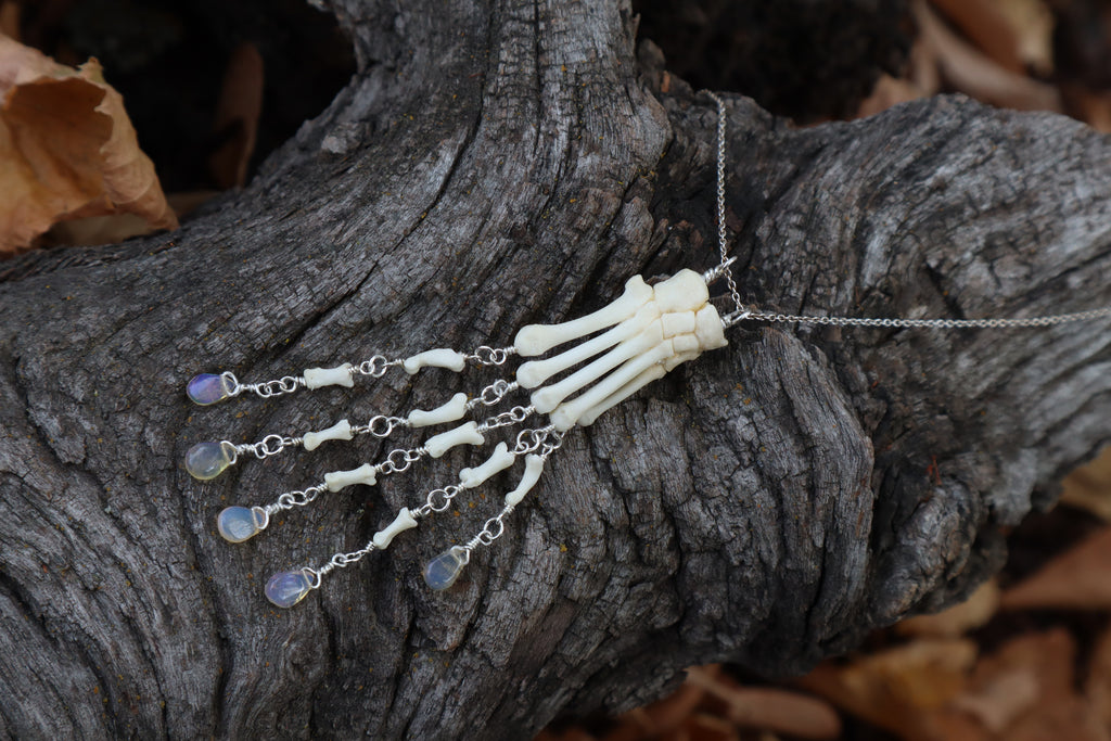 Fluid Striped Skunk Paw Articulation Necklace with Opal “Claws”
