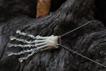 Fluid Striped Skunk Paw Articulation Necklace with Opal “Claws”