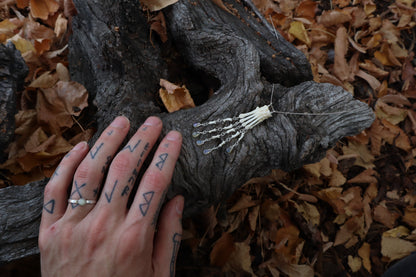 Fluid Striped Skunk Paw Articulation Necklace with Opal “Claws”
