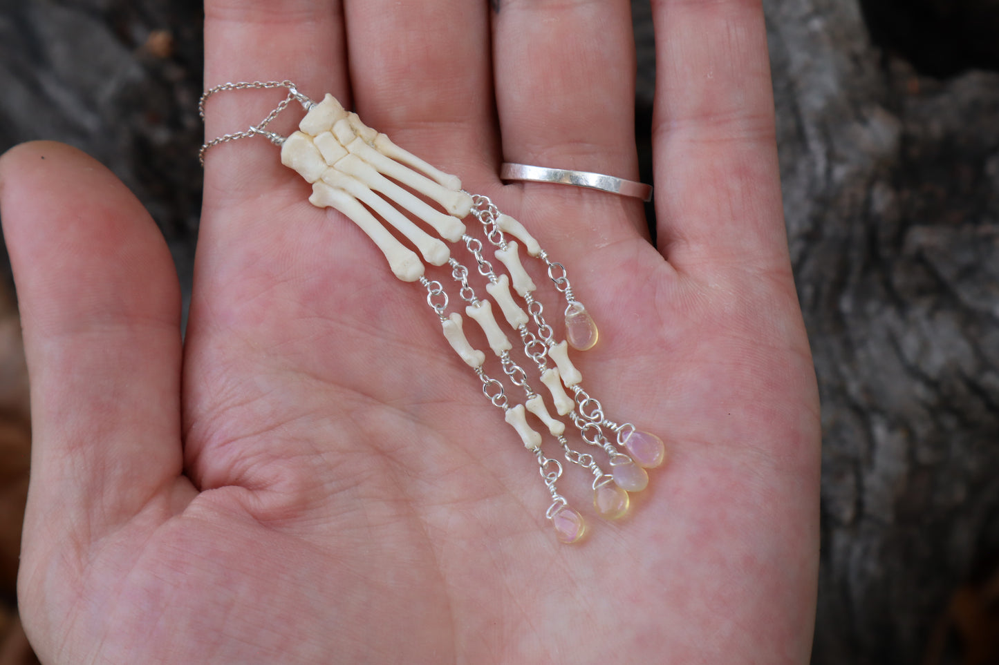 Fluid Striped Skunk Paw Articulation Necklace with Opal “Claws”