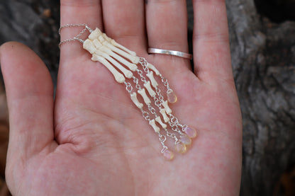 Fluid Striped Skunk Paw Articulation Necklace with Opal “Claws”
