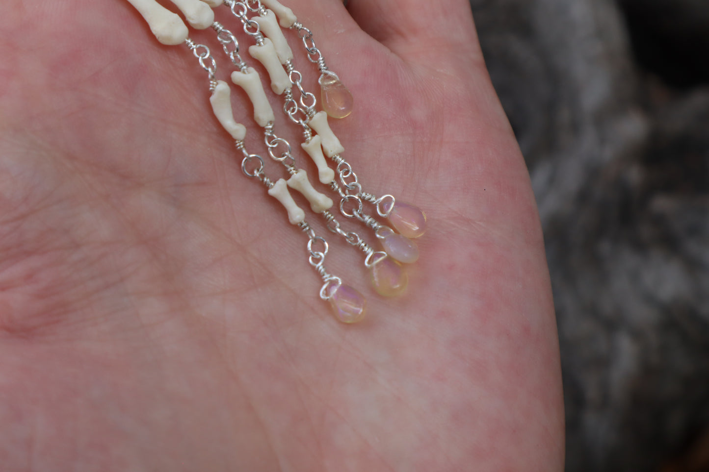 Fluid Striped Skunk Paw Articulation Necklace with Opal “Claws”