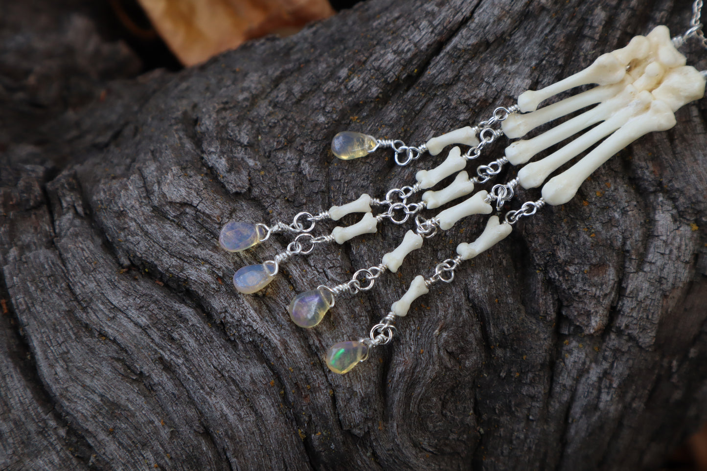 Fluid Striped Skunk Paw Articulation Necklace with Opal “Claws”