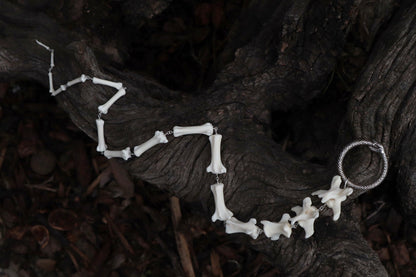 Fluid Gray Wolf Tail Articulation with Ouroboros Ring