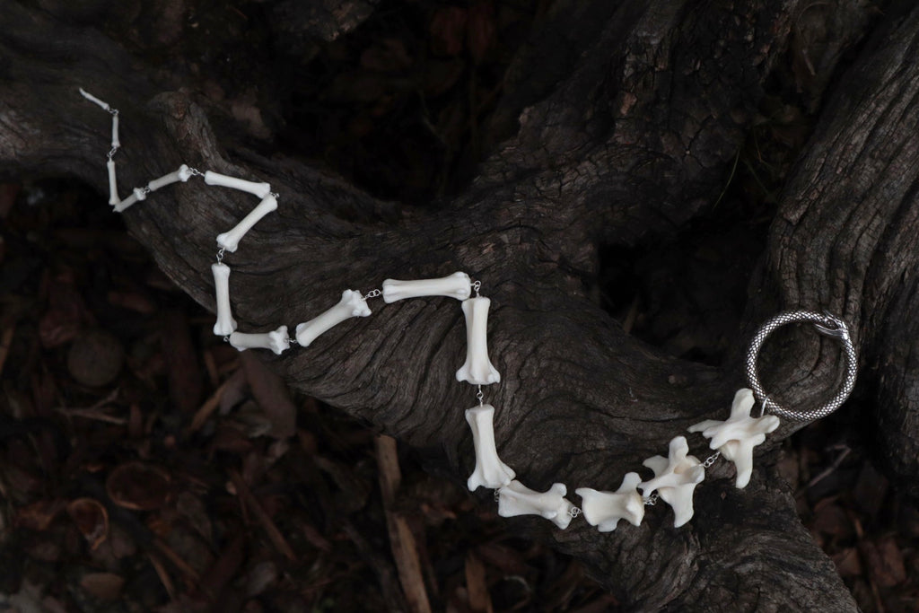 Fluid Gray Wolf Tail Articulation with Ouroboros Ring