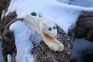 Reserved for Amanda - Mountain Lion Bone Carving with an Emerald and Peridot Eyes