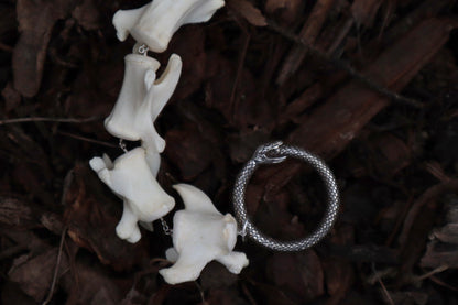 Pathological Fluid Mountain Lion Tail Articulation with Ouroboros Ring