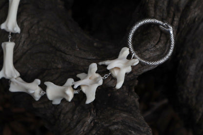 Fluid Gray Wolf Tail Articulation with Ouroboros Ring