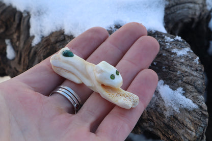 Reserved for Amanda - Mountain Lion Bone Carving with an Emerald and Peridot Eyes