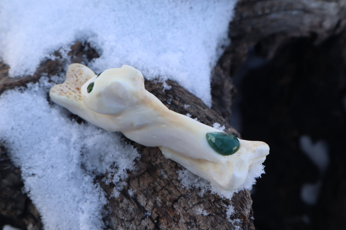 Reserved for Amanda - Mountain Lion Bone Carving with an Emerald and Peridot Eyes