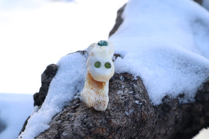 Reserved for Amanda - Mountain Lion Bone Carving with an Emerald and Peridot Eyes